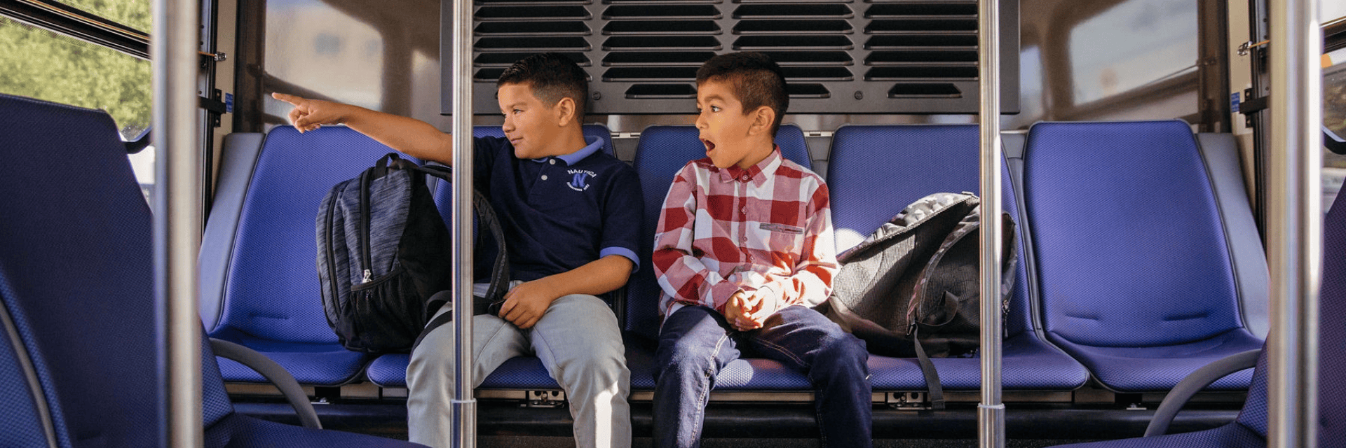 Boys on bus looking out the window
