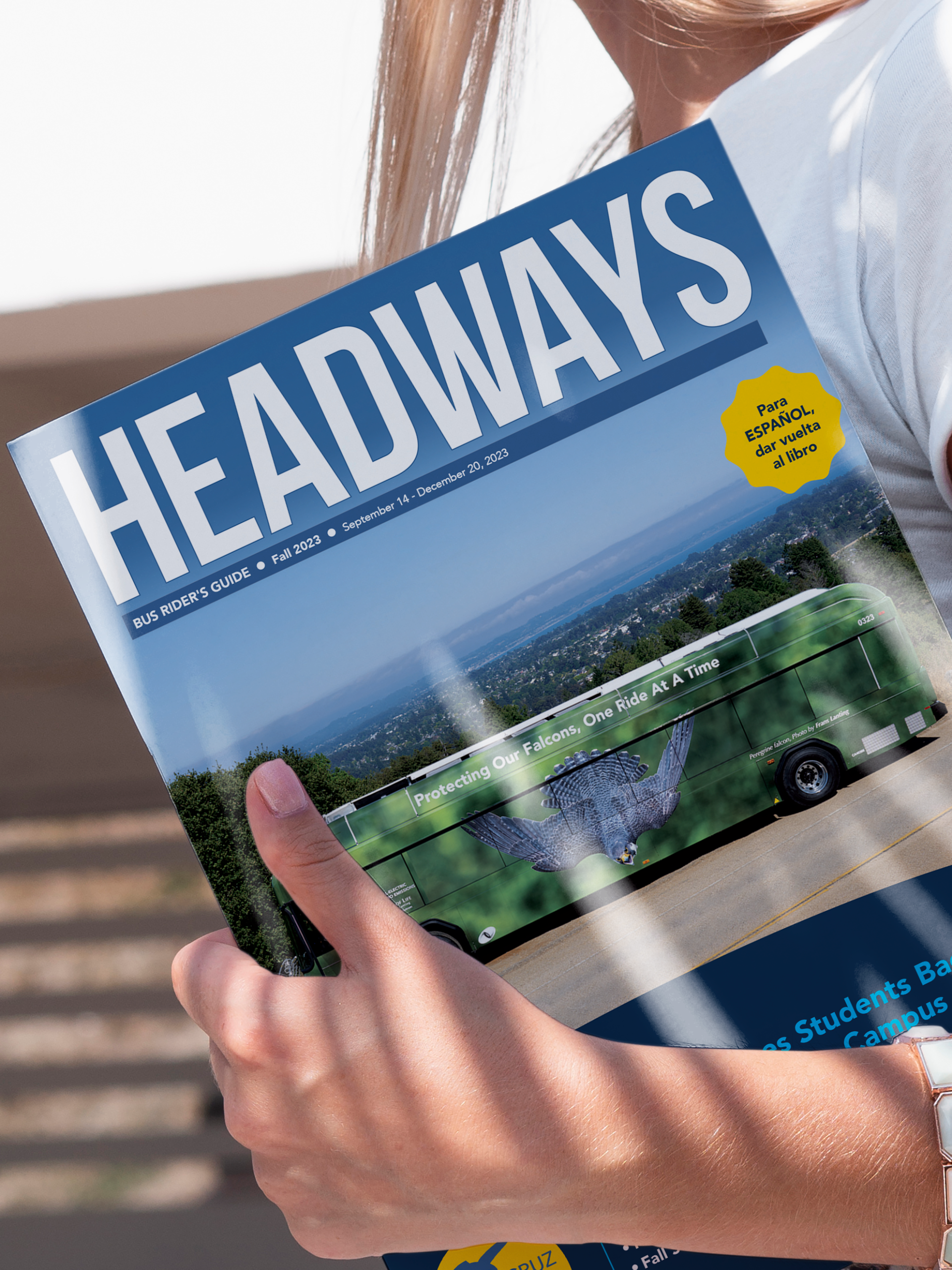 Hand holding headways magazine